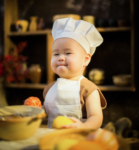 Baby in a chef hat