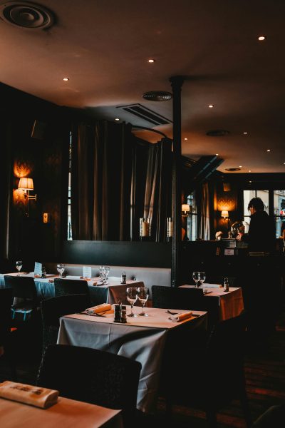 a quiet restaurant with tables and chairs